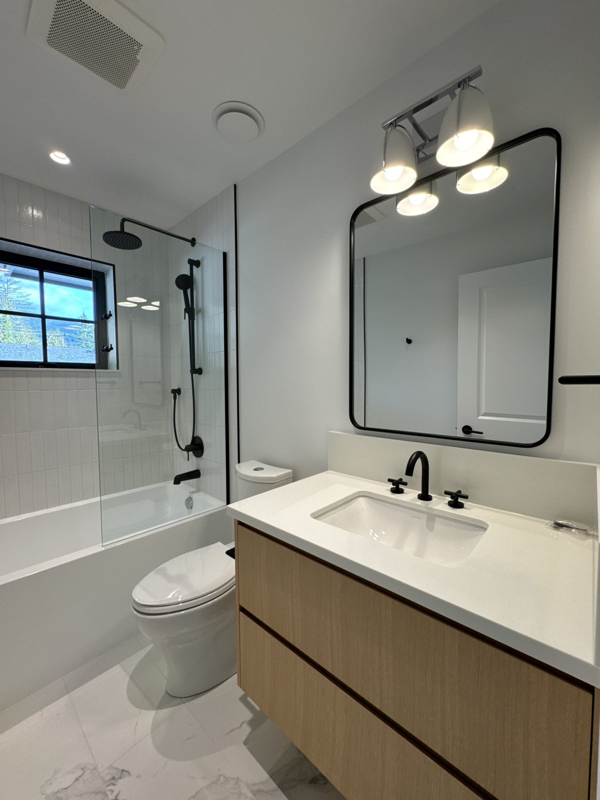 A Mirror Upgrade That Makes Port Coquitlam Bathrooms Feel Like a New Space